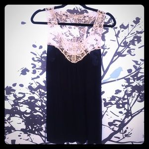 Sleeveless navy tunic with crocheted detailing